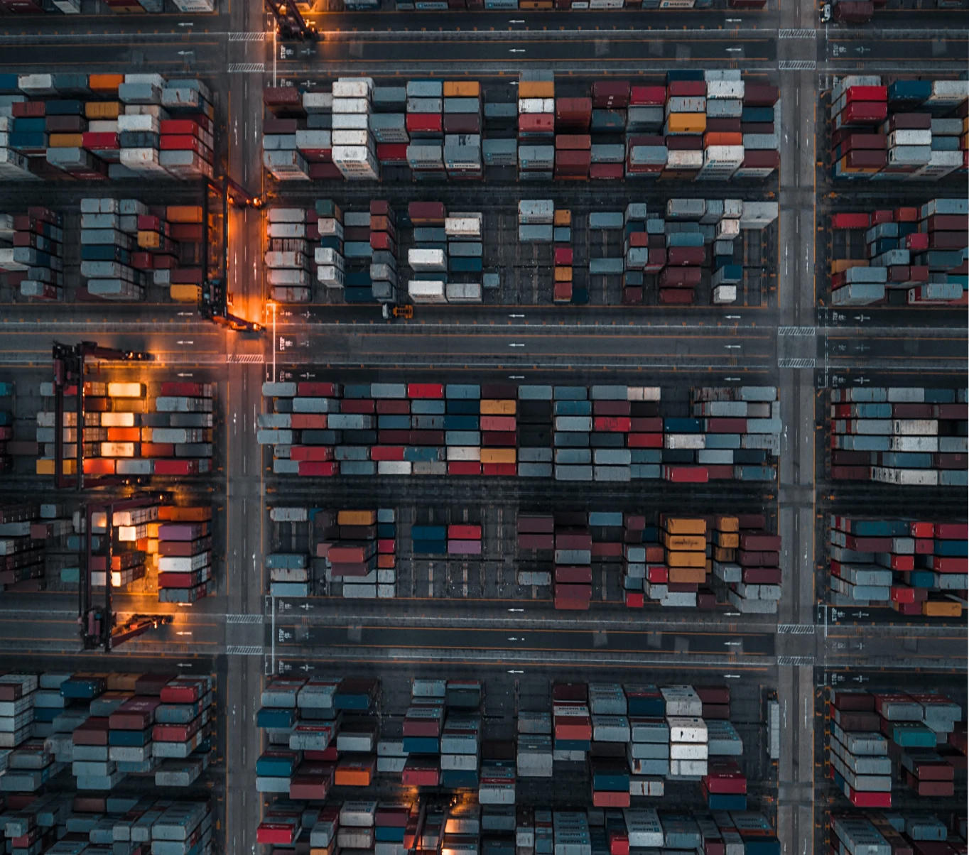 A top-down view showing a shipping yard, with hundreds of shipping containers in sight
